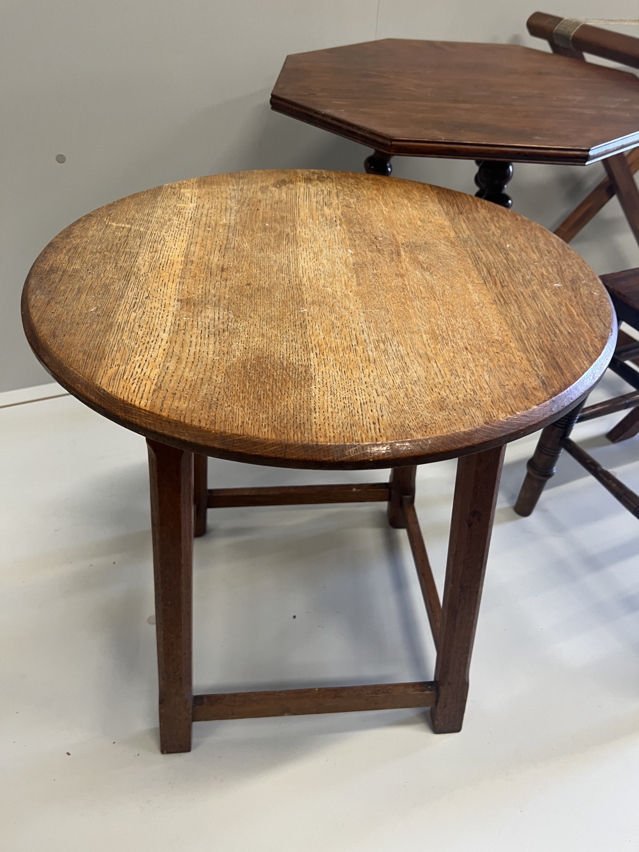 A late Victorian mahogany luggage rack, an octagonal occasional table, a circular oak table, butler's tray stand and an elbow chair